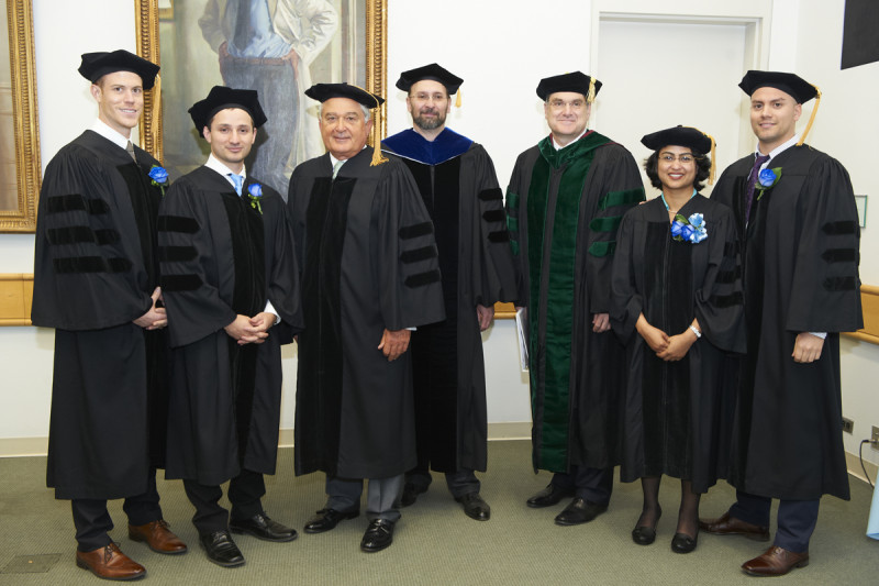 Pictured: Louis Gerstner, Kenneth Marians, Craig Thompson, James Dowdle, Dimiter Tassev, Semanti Mukhurjee, and Eric Alonzo